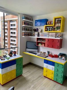 two lego themed desks are in the corner of a room with a large window