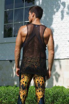 Perfect for those hot summer days and late-night dance parties, this mens mesh tank top features paneling in different mesh fabrics for a unique, eye-catching look. Crafted from high-quality, super breathable mesh materials, this see through fishnet top will keep you cool and comfortable all day (and night) long. The black color gives it a sleek and versatile appearance, while the mixed mesh paneling adds a touch of edginess and style. Whether you're looking to stand out in the crowd or just wan Summer Gym Racerback Vest, Summer Racerback Gym Vest, Stretch Racerback Vest For Summer, Breathable Sleeveless Tank Top For Summer, Summer Mesh Top With Mesh Sleeves, Breathable Tank Vest For Summer, Breathable Tank Top Vest For Summer, Club Mesh Top, Summer Gym Tops With Mesh Back