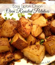 a plate full of cooked potatoes on a table with the words easy lipton onion oven roasted potatoes