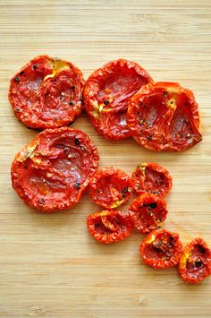 sliced up tomatoes on a cutting board ready to be cooked