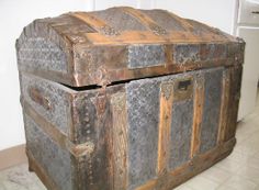 an old trunk is sitting on the floor