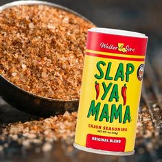 a can of slap ya mama sitting next to a bowl of ground meat on a table