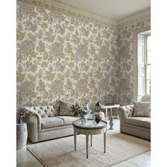 a living room with floral wallpaper and furniture