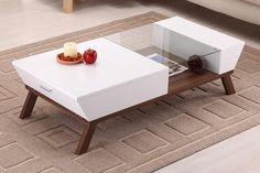 a white coffee table sitting on top of a rug