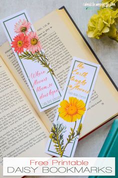 an open bookmark with flowers on it and the words, free printable daisy bookmarks