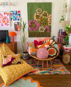 a living room filled with lots of colorful pillows