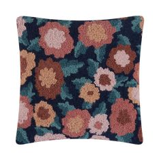 a blue and pink pillow with flowers on it