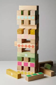 a stack of wooden blocks sitting on top of a table