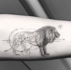 a man's arm with a lion tattoo on it