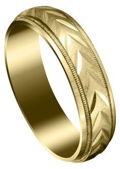 a wedding ring with an intricate design in yellow gold