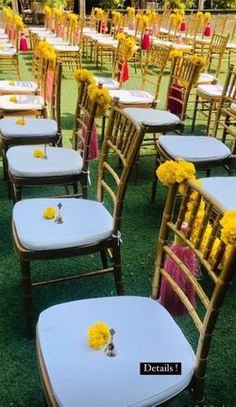 rows of chairs with yellow flowers on them and white tablecloths set up for an outdoor ceremony