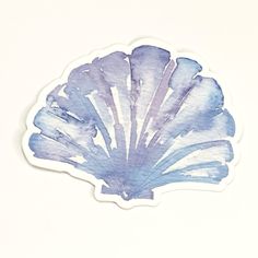 a blue and white shell sticker on a white background