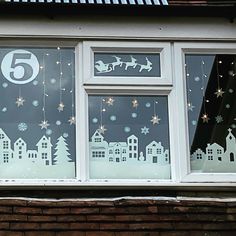 there is a window decorated with christmas decorations