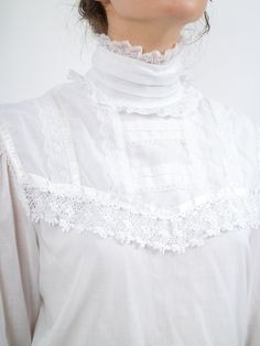 product details: era: 1970s fabric content: cotton colour: white condition: great measurements: bust (around): 38” waist (around): 37” hip (around): 40” length: 22.5” sleeve length: 23” models measurements: bust (around): 34" waist (around): 27" hip (around): 39" height: 5'10" **all vintage sales are final** 1970s Fabric, Edwardian Blouse, Gunne Sax, Lolita Fashion, Blouse Styles, 1970s, Textiles, Sleeve Length, Trending Outfits