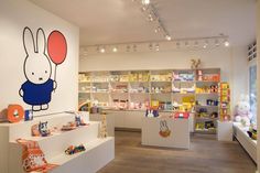 the interior of a children's store with toys and books on display in it