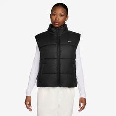 Step up your casual looks with this stylish women's Nike Sportswear classic puffer therma-fit loose vest.Click on this WOMEN'S GUIDE to find the perfect fit and more! Step up your casual looks with this stylish women's Nike Sportswear classic puffer therma-fit loose vest.Click on this WOMEN'S GUIDE to find the perfect fit and more! TECHNOLOGIES & FEATURES Nike Therma-FIT technology helps manage your body's natural heat to help keep you warm in cold-weather conditions Water-repellent finish helps Black Sporty Puffer Vest, Sporty Spring Outerwear Vest, Sporty Vest Outerwear For Fall, Spring Puffer Vest For Streetwear, Functional Sports Vest For Fall, Sporty Winter Vest, Black Puffer Vest For Spring, Black Sports Vest For Winter, Black Winter Sports Vest