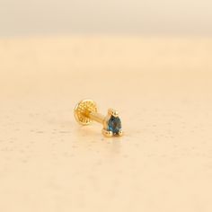 This Tiny Pear Cut London Blue Topaz screw back earring is a stud cartilage earring/labret. It is handcrafted from 14 Karat Solid Gold. White and Rose Gold options are not colored after production, they are entirely produced solid rose or white gold. The stone is 3x2 mm sized pear cut genuine London Blue Topaz. The closure is screw flat or screw ball back as shown in the picture. PRODUCT DETAILS: This listing is for a single earring/piercing. If you wish to purchase as a pair, please choose quan Second Hole Earrings, Earring Piercing, Earring Cartilage, Medusa Piercing, Tragus Earring, Conch Earring, Tragus Earrings, Helix Earrings, Cartilage Earring