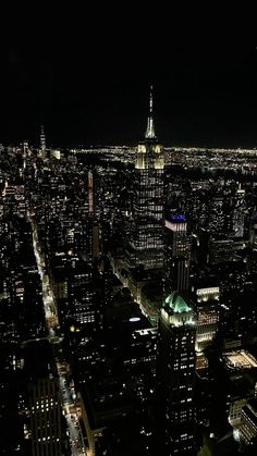 an aerial view of new york city at night from the top of the empire building