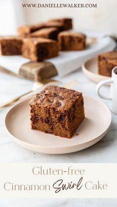 gluten - free cinnamon swirl cake on a plate with coffee in the background