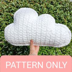 a hand holding up a white cloud pillow with the words pattern only written below it