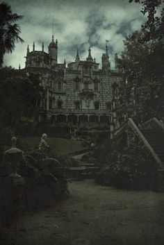 an old photo of a castle in the dark