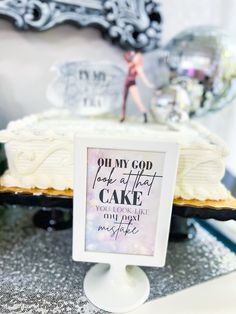 there is a cake on the table with a sign in front of it that says pum my god took after cake