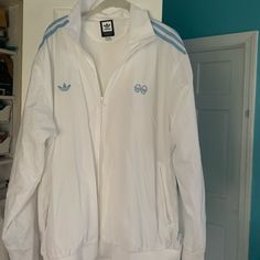 Adidas Full Zip Windbreaker Never Worn In Size Xl White Long Sleeve Track Jacket For Spring, White Adidas Windbreaker For Spring, Adidas White Outerwear For Spring, Adidas White Athleisure Track Jacket, White Adidas Outerwear For Spring, White Adidas Hooded Windbreaker, White Hooded Adidas Windbreaker, Adidas Casual White Track Jacket, Casual White Adidas Track Jacket