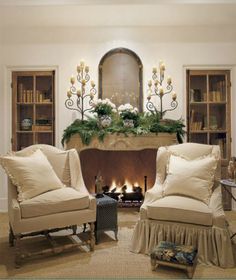 a living room filled with furniture and a fire place in the middle of a room