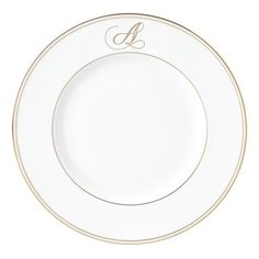 an empty white plate with gold trim