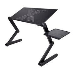 a black computer desk with a laptop on it's stand and mouse pad underneath