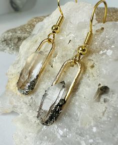 Raw Quartz Crystal Paperclip Gold Earrings  ✨ 18k Goldplated Brass (hypo-allergenic and nickel-free) ✨ Handmade and handset stones ✨ Raw Quartz Crystal ✨ Master Healer ✨ Pyrite  ✨ Abundance   Lightweight and absolutely Radiant from all angles! These are sure to be a One of a kind gift or treat for yourself🥰 All pieces are individually handmade by ME and I use natural stones-no two pieces can ever be the exact same! All items are shipped ready to gift or enjoy as a treat. Feel free to reach out Raw Quartz Earrings, Crystal Point Earrings, Paperclip Earrings, Raw Crystal Earrings, Raw Quartz Crystal, Raw Quartz, Birthstone Earrings, April Birthstone, Birthstone Earring