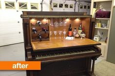 an old piano has wine glasses on it and is being displayed in front of the camera