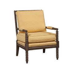 an upholstered chair with wooden legs and yellow fabric on the armrests