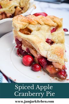 a slice of apple cranberry pie on a white plate with text overlay