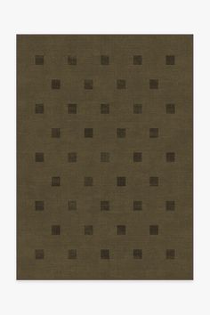 a brown area rug with squares and rectangles on the top, in front of a white background