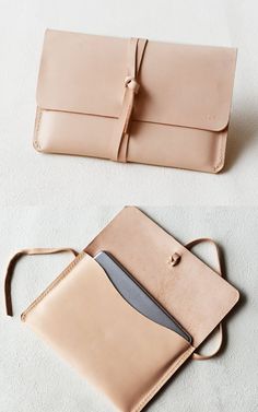 two purses sitting next to each other on a white surface