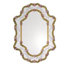 an ornate mirror with pink flowers and gold trimmings on the edge is shown against a white background