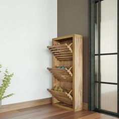 a wooden shoe rack sitting on top of a hard wood floor