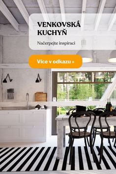 an image of a dining room with black and white stripes on the floor, and a kitchen in the background