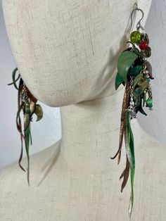 Absolutely stunning handmade one-of-a-kind leather earrings. Hand curled, painted, and fringed. Nature inspired jewelry. Unique jewelry. Nature Inspired Earrings, Green Leather Dangle Earrings, Green Leather Dangle Jewelry, Painted Leather Earrings, Earrings Nature, Painting Leather, Nature Inspired Jewelry, Custom Earrings, Inspired Jewelry