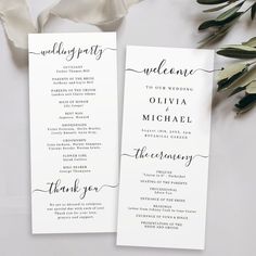 two white wedding programs with calligraphy on them