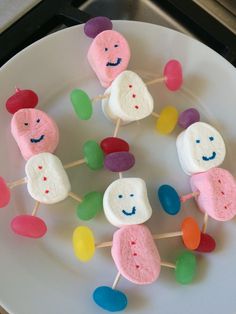 marshmallows are arranged on a white plate