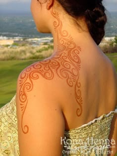 a woman with a tattoo on her back