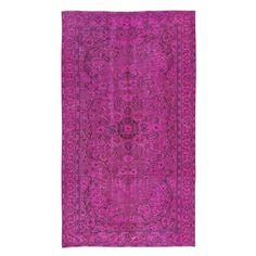 a purple rug with an intricate design on it