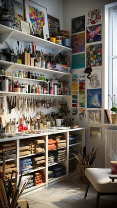 a room filled with lots of crafting supplies and art work on shelves next to a window