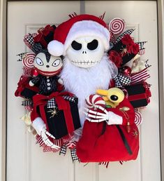 a wreath with a skeleton and santa clause on it