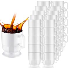 a coffee cup filled with liquid and stacked on top of each other next to stacks of cups