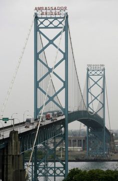 a bridge with cars going over it and the word ambassador on top is in english