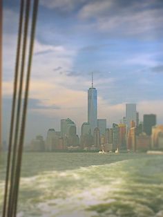 the city skyline as seen from a boat in the water