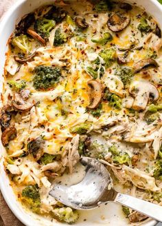 a casserole dish with broccoli, mushrooms and cheese in it is ready to be eaten